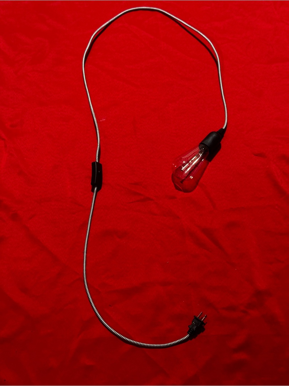 Unlisted Red and Black Cord Lamp with Clear Bulb